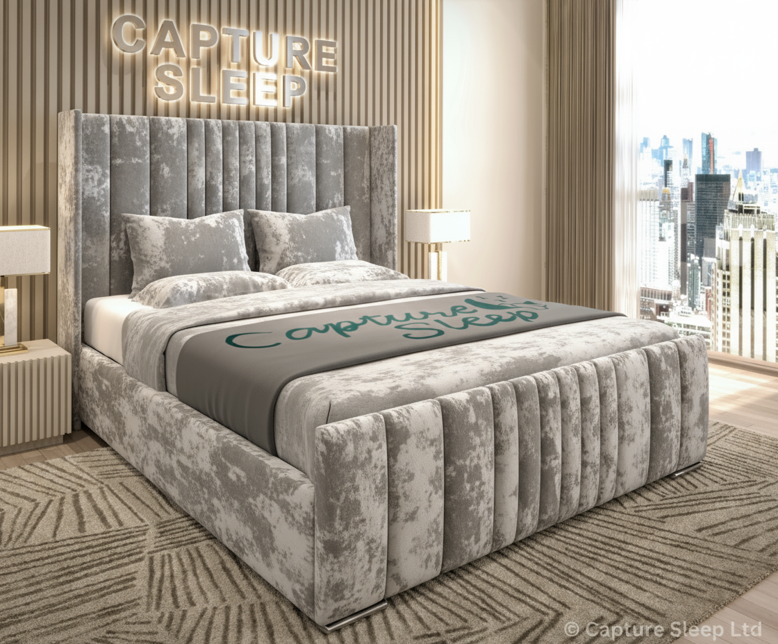 An elegant gray wingback bed frame with a plush velvet fabric, displayed in a stylish room setting.